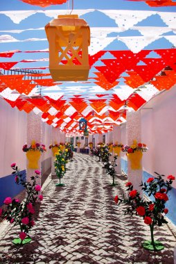 Flowery streets, traditional party, Redondo village, Portugal. clipart