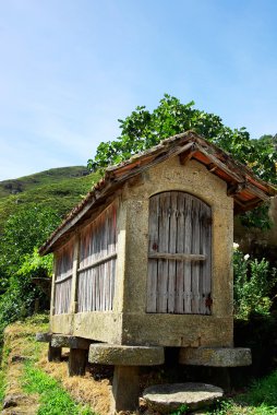 Espigueiros - old and typical warehouse to store maize and spike clipart