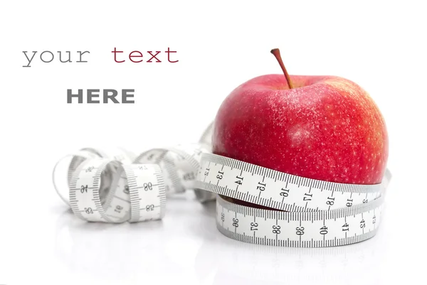 Red apple and tape measure — Stock Photo, Image