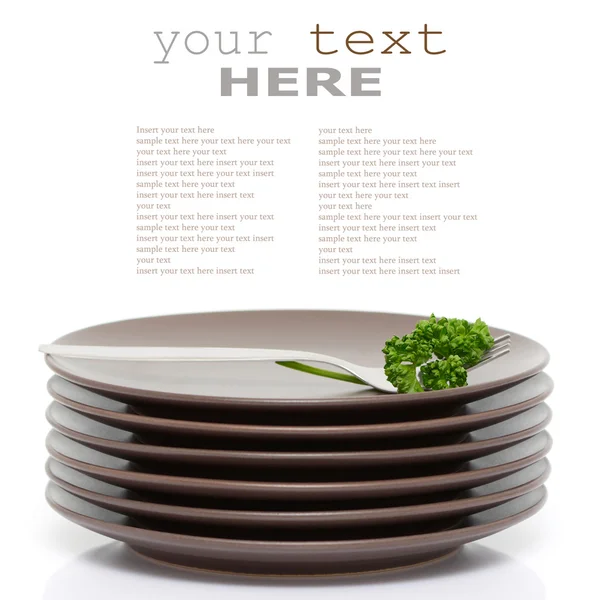 Plates, fork and parsley — Stock Photo, Image