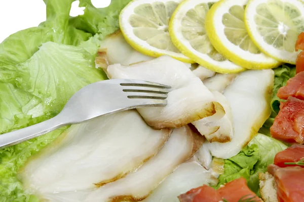 Fork , fish slices and lemon — Stock Photo, Image