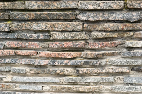 Bakgrund av gammalt granit mur — Stockfoto