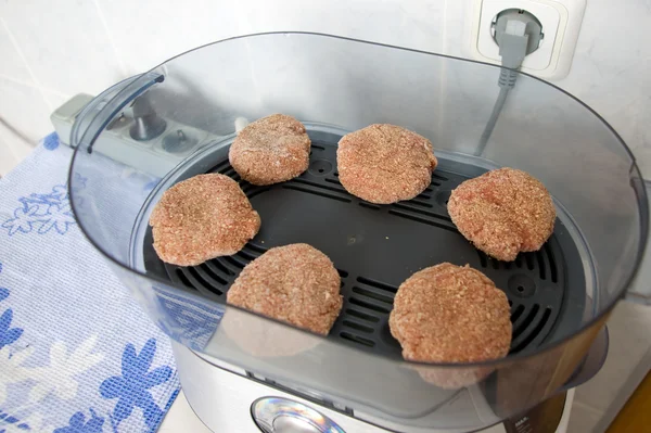 Stock image Meat patties are steam bath