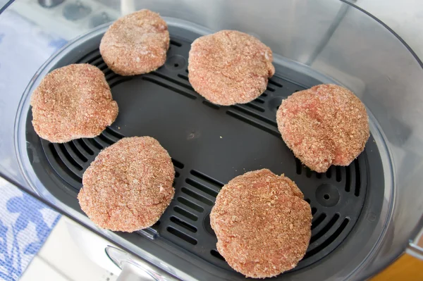 Stock image Meat patties are steam bath