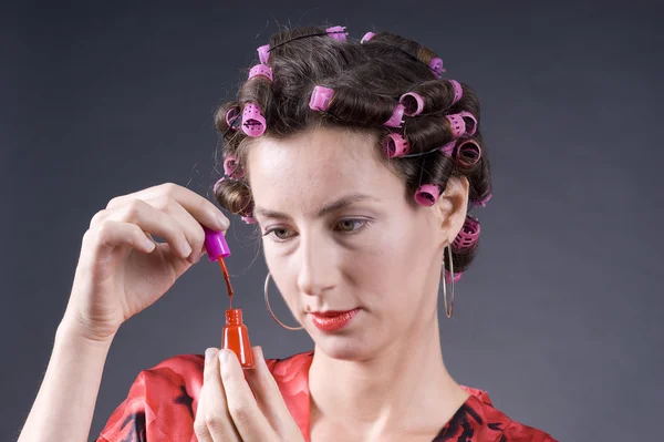 Stock image Beautiful young woman with bigoudi on the hair