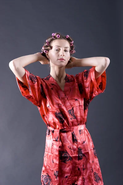 Stock image Beautiful young woman with bigoudi on the hair