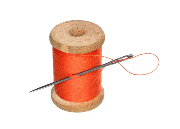 Thread roll and a needle. — Stock Photo, Image