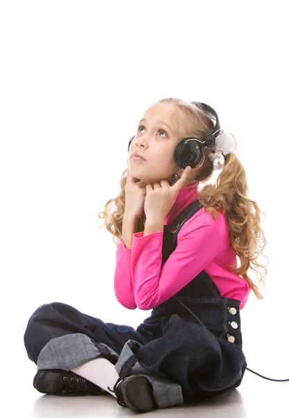 stock image Little girl listening music