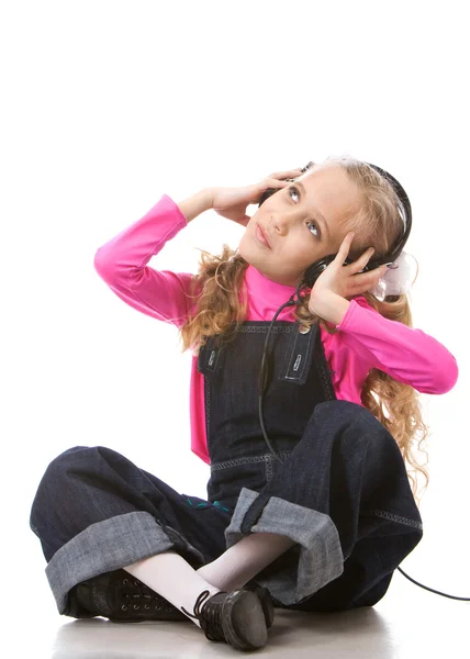 stock image Little girl listening music