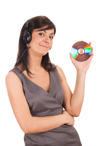 Young lady holding CD and listening to music — Stock Photo, Image