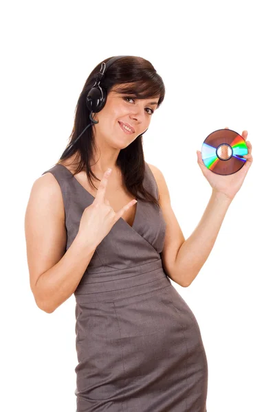 Νεαρή κοπέλα κρατώντας το cd και να ακούτε μουσική — Φωτογραφία Αρχείου