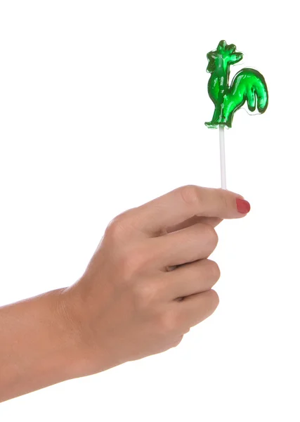 Lollipop i en hand — Stockfoto