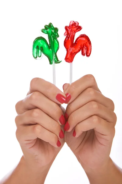 Lollipop i en hand — Stockfoto