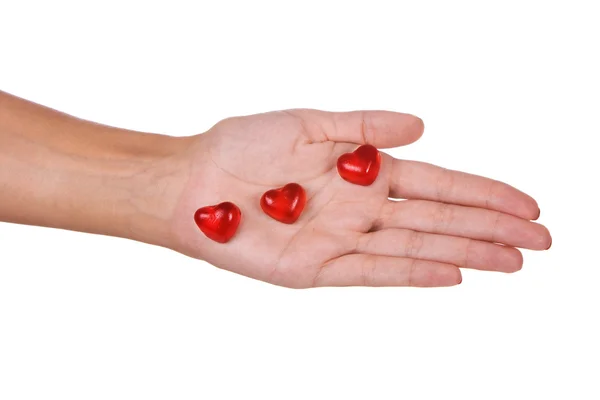 Herzförmige Bonbons in der Hand — Stockfoto
