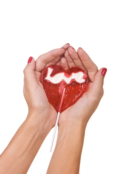 心脏的形状棒棒糖在手 — 图库照片