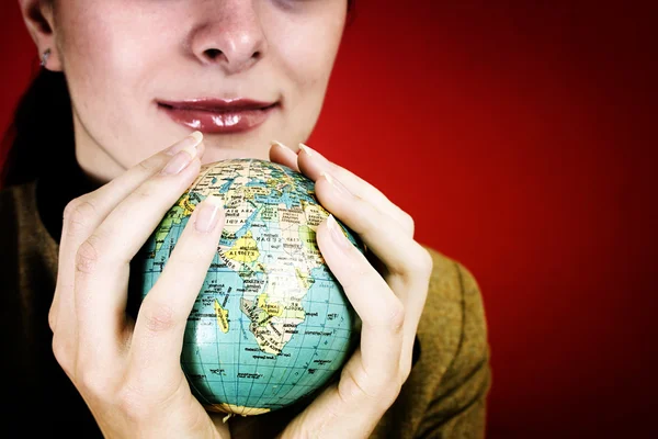 Globe in a girl's hands — Stock Photo, Image