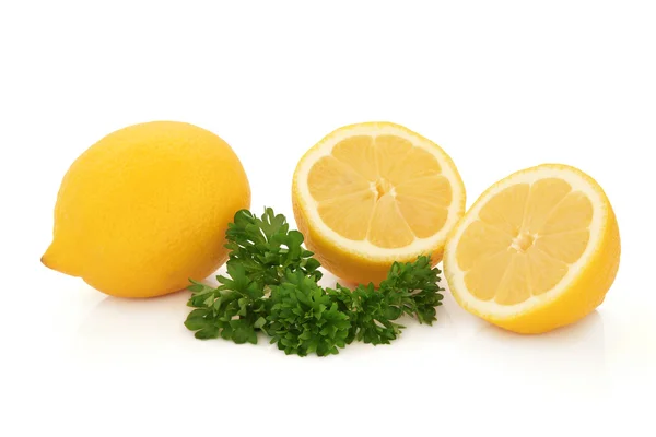 Zitronenfrucht und Petersilienkraut — Stockfoto