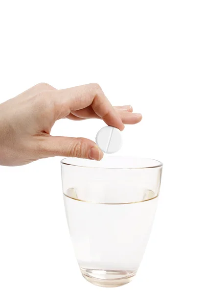 Šumění tabletu a sklenici vody — Stock fotografie