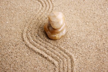 Zen stone in the sand clipart