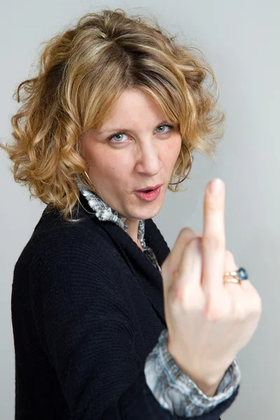 Girl who makes rude gestures — Stock Photo, Image