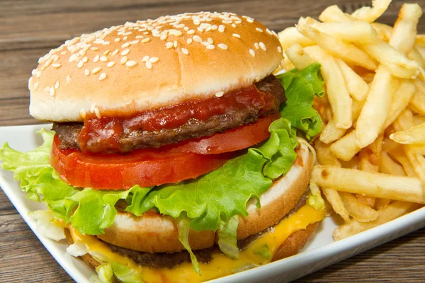 Hamburger with potatoes — Stock Photo, Image