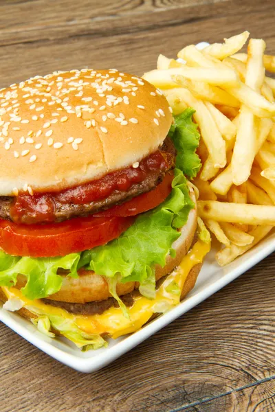 Hamburger with potatoes — Stock Photo, Image