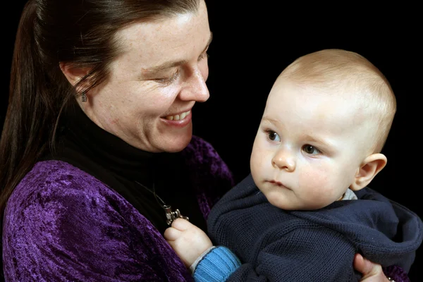 Mother holding young toddler — Stock Photo, Image