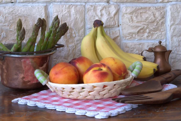 stock image Peaches and bananas on the table