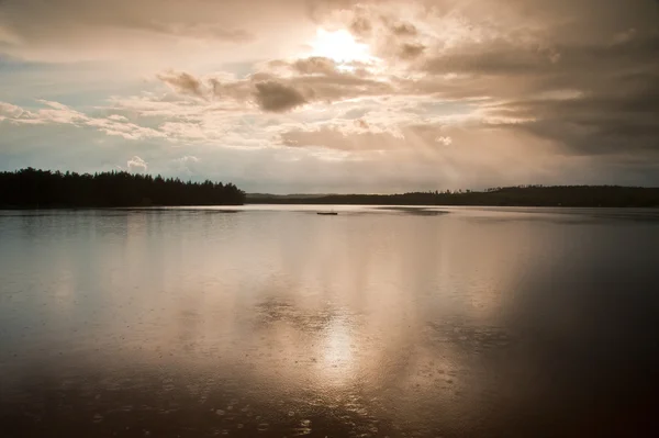 Rain over a lake in Sweden — стокове фото