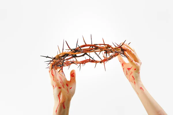 Crown of thorns and hands — Stock Photo, Image