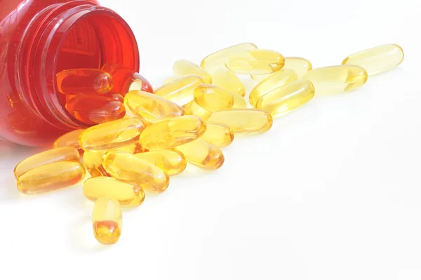 Yellow fish oil capsule pile — Stock Photo, Image