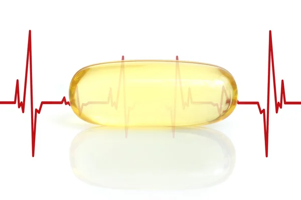 Capsula di olio di pesce giallo ed elettrocardiogramma — Foto Stock