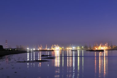 Shipyard in night time clipart