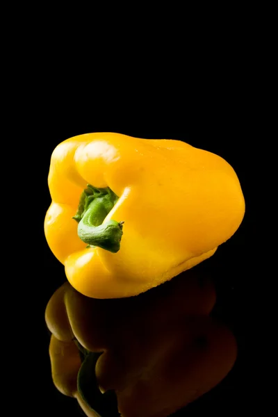 Pepper on black backround — Stock Photo, Image