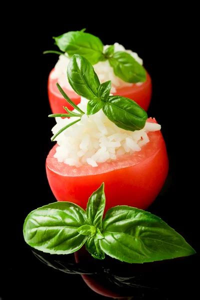 Stuffed tomatoes with rice isolated on black — Stock Photo, Image