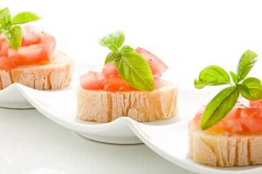 Bruschetta with tomatoes and basil isolated