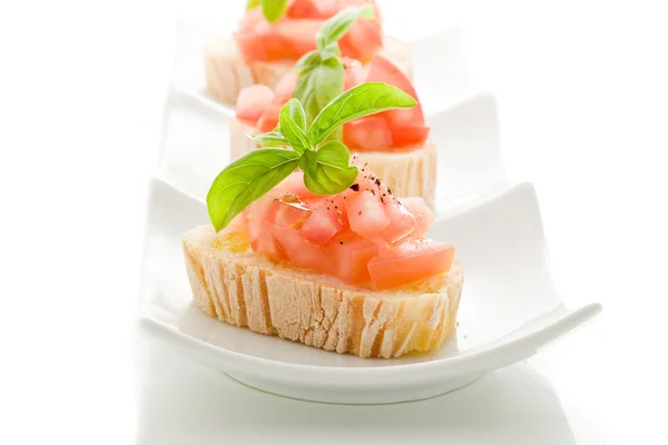 Bruschetta with tomatoes and basil isolated — Stockfoto