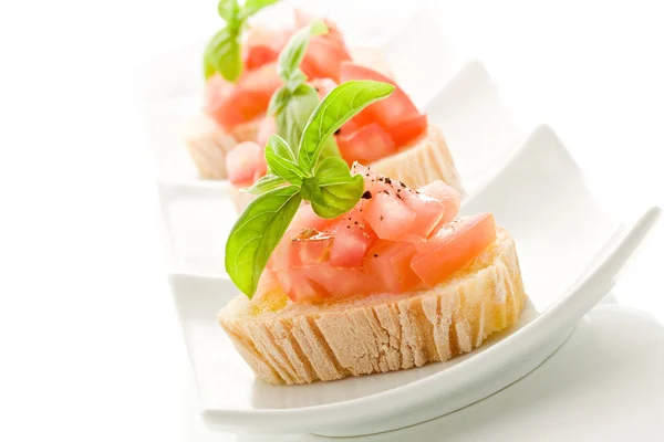 Bruschetta with tomatoes and basil isolated — Stockfoto