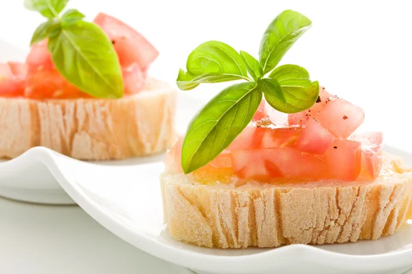 Bruschetta with tomatoes and basil isolated — Stock Photo, Image