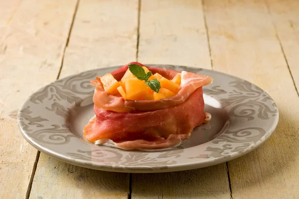 Ham and melon appetizer — Stock Photo, Image