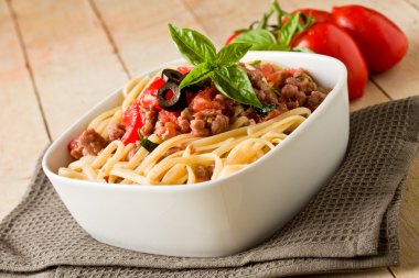 Pasta with italian sausage meat sauce clipart