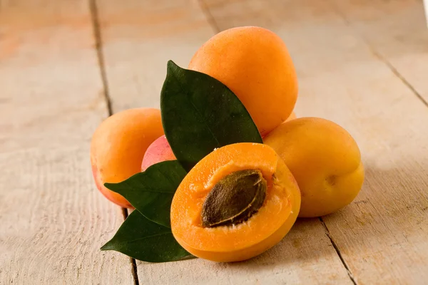 Apricot on wooden table — Stock Photo, Image