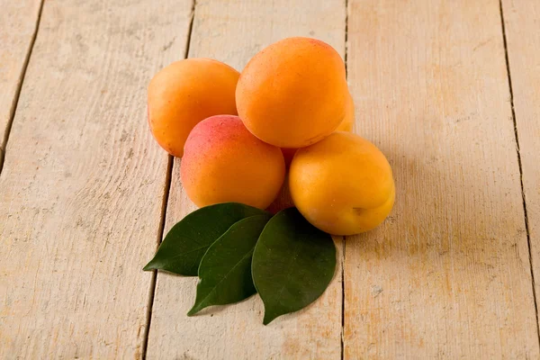 Apricot on wooden table — Stock Photo, Image