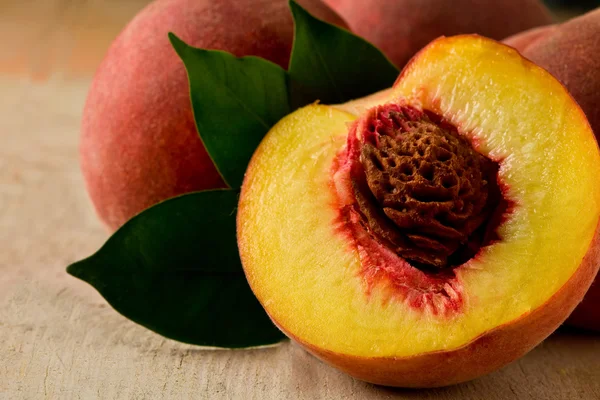 Peach on wooden Table — Stock Photo, Image