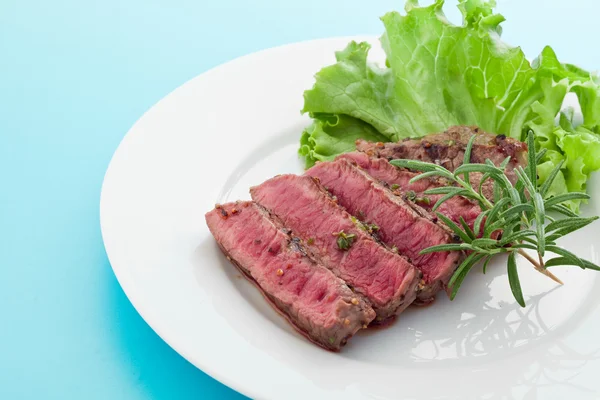 Beef steak with rosemary — Stock Photo, Image