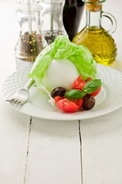 Buffalo Mozzarella with wrapped lettuce clipart