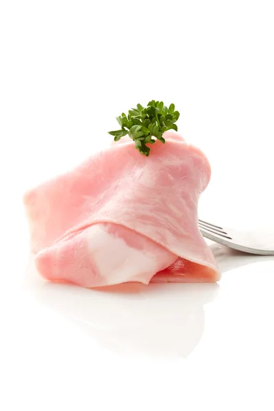 Fetta di prosciutto morbido avvolta sulla forchetta — Foto Stock