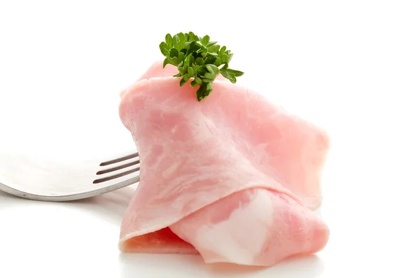 Fetta di prosciutto morbido avvolta sulla forchetta — Foto Stock