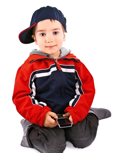 Маленький хлопчик з мобільним телефоном — стокове фото