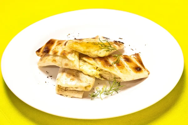 stock image A grilled sandwich of melting cheese, on a white plate